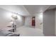 Partially finished basement offers flexible living space with desk area at 7081 Warren Dr, Denver, CO 80221