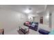 Finished basement area features plush seating and comfortable layout at 7081 Warren Dr, Denver, CO 80221