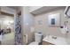 Modest bathroom showing toilet, sink, cabinet, and shower at 7081 Warren Dr, Denver, CO 80221
