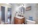 Clean bathroom features modern sink, vanity, and tile flooring at 7081 Warren Dr, Denver, CO 80221