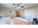 Comfortable bedroom features a ceiling fan, closet, and neutral-toned walls at 7081 Warren Dr, Denver, CO 80221