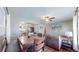 Stylish dining and living area with hardwood floors, offering a seamless transition to the modern kitchen, perfect for entertaining at 7081 Warren Dr, Denver, CO 80221