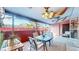 Cozy patio with outdoor seating, decorative rug, and views of the backyard at 7081 Warren Dr, Denver, CO 80221