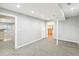 Spacious basement with carpet, neutral walls, and multiple doorways leading to other rooms at 7400 W Grant Ranch Blvd # 52, Littleton, CO 80123
