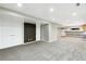 Spacious finished basement area with carpet flooring and a bar with ample counter space at 7400 W Grant Ranch Blvd # 52, Littleton, CO 80123