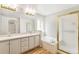 Bright bathroom with dual sink vanity, soaking tub and glass shower at 7400 W Grant Ranch Blvd # 52, Littleton, CO 80123