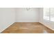 Spacious dining room with hardwood floors, natural light, and a modern chandelier at 7400 W Grant Ranch Blvd # 52, Littleton, CO 80123