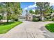 Well-maintained home with a long driveway leading to the garage and stone accents at 7400 W Grant Ranch Blvd # 52, Littleton, CO 80123