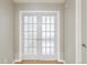 Bright hallway with white french doors at 7400 W Grant Ranch Blvd # 52, Littleton, CO 80123