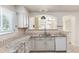 Kitchen featuring a granite countertop and breakfast bar at 7400 W Grant Ranch Blvd # 52, Littleton, CO 80123