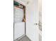 Laundry closet with stacked washer and dryer, conveniently located near the stairs at 7400 W Grant Ranch Blvd # 52, Littleton, CO 80123
