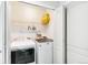 Functional laundry room with washer, dryer, shelving, and ample storage space at 7400 W Grant Ranch Blvd # 52, Littleton, CO 80123