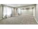 Large, carpeted living room with large windows, recessed lighting, and ample natural light at 7400 W Grant Ranch Blvd # 52, Littleton, CO 80123