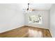 Bright living room features beautiful hardwood floors and a modern ceiling fan at 7400 W Grant Ranch Blvd # 52, Littleton, CO 80123