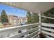 Apartment balcony overlooking the parking area at 8555 Fairmount Dr # B202, Denver, CO 80247