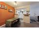 Dining area next to kitchen with a table and bench, perfect for casual meals at 8555 Fairmount Dr # B202, Denver, CO 80247