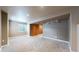 Finished basement with neutral carpet and two closets at 11301 Vernon Way, Parker, CO 80134