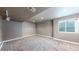 Finished basement featuring neutral carpet and natural lighting at 11301 Vernon Way, Parker, CO 80134
