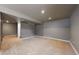 Spacious basement area with neutral carpeting, recessed lighting, and ample room for various activities at 11301 Vernon Way, Parker, CO 80134