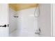 Clean and functional bathtub and shower featuring white tile and chrome fixtures at 11301 Vernon Way, Parker, CO 80134