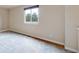 Bright bedroom with neutral carpet and a large window with natural lighting at 11301 Vernon Way, Parker, CO 80134