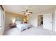 Bedroom with neutral color scheme, ceiling fan, and lots of natural light at 11301 Vernon Way, Parker, CO 80134