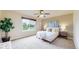 Bedroom with natural light, ceiling fan, and neutral decor, creating a relaxing atmosphere at 11301 Vernon Way, Parker, CO 80134