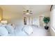 Bright bedroom with neutral colors, ceiling fan, and multiple closets for ample storage at 11301 Vernon Way, Parker, CO 80134