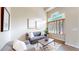 A bright and inviting living room featuring high ceilings, modern decor, and large windows with natural lighting at 11301 Vernon Way, Parker, CO 80134