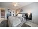 Well-appointed bedroom with neutral colors, ceiling fan and stylish decor at 8798 Chase Dr # 4, Arvada, CO 80003
