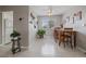Inviting dining area features a wood table, three chairs, a ceiling fan, and recessed lighting at 8798 Chase Dr # 4, Arvada, CO 80003
