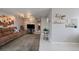 Cozy living room with wood accent wall, soft lighting, and comfortable seating at 8798 Chase Dr # 4, Arvada, CO 80003