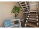 Exterior stairwell and entryway accented with a bench and decorative plants at 8798 Chase Dr # 4, Arvada, CO 80003