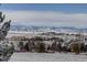 Snowy landscape with mountain views and houses at 3925 Broadview Pl, Castle Rock, CO 80109