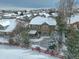 Two-story house with snowy backyard in a neighborhood at 3925 Broadview Pl, Castle Rock, CO 80109