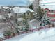 Two-story house with snowy backyard and surrounding homes at 3925 Broadview Pl, Castle Rock, CO 80109