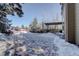 Spacious brick patio, partially covered in snow, with seating at 3925 Broadview Pl, Castle Rock, CO 80109