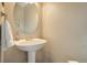 Small bathroom with pedestal sink and oval mirror at 3925 Broadview Pl, Castle Rock, CO 80109