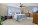 Main bedroom with a king-size bed and access to the ensuite bathroom at 3925 Broadview Pl, Castle Rock, CO 80109