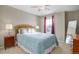 Bedroom with full bed, nightstands, and large mirror at 3925 Broadview Pl, Castle Rock, CO 80109