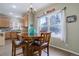 Bright breakfast nook with wooden table and chairs, overlooking backyard at 3925 Broadview Pl, Castle Rock, CO 80109