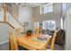 Open dining area with a wooden table and chairs, adjacent to kitchen at 3925 Broadview Pl, Castle Rock, CO 80109