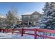 Two-story house, snowy backyard, and wooden deck with pergola at 3925 Broadview Pl, Castle Rock, CO 80109