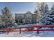 Two-story house with snowy backyard and red fence at 3925 Broadview Pl, Castle Rock, CO 80109