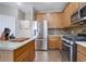 Updated kitchen featuring stainless steel appliances and wood cabinets at 3925 Broadview Pl, Castle Rock, CO 80109