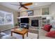 Living room showcasing a fireplace and a large TV at 3925 Broadview Pl, Castle Rock, CO 80109