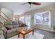 Spacious living room featuring a comfortable couch and access to a backyard patio at 3925 Broadview Pl, Castle Rock, CO 80109