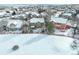 Aerial view of a snowy neighborhood with various houses at 3925 Broadview Pl, Castle Rock, CO 80109