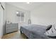 Neutral bedroom with a double bed, window, a dresser, and closet at 5278 Warrior St, Frederick, CO 80504
