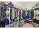 Walk-in closet with ample storage space, including shelves, hanging racks, and drawers at 5278 Warrior St, Frederick, CO 80504